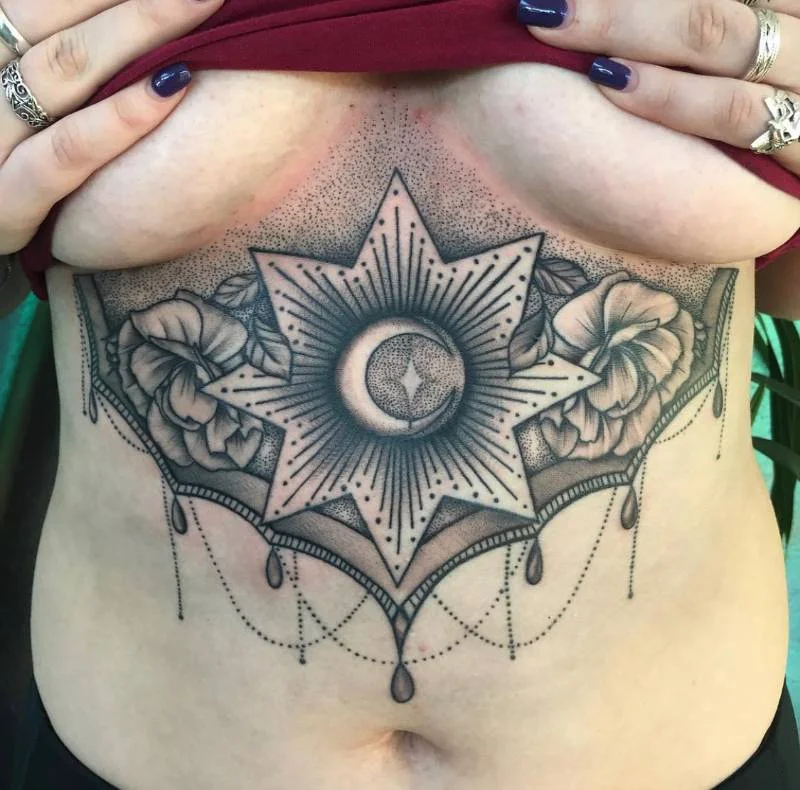 Heather Baldwin dotwork geometric floral tattoo — crescent moon and star with flowers, underbust placement, Hawaii